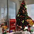 Happy holidays with Christmas tree, elves, and mailbox display created by Interior Tropical Gardens